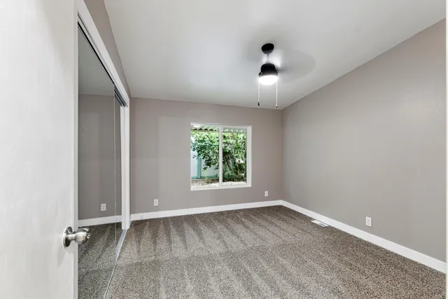 an empty room with a empty space and a window