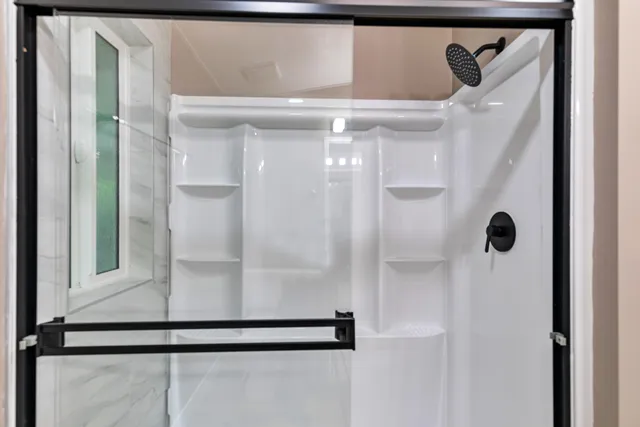 a view of cabinets chair and wooden floor