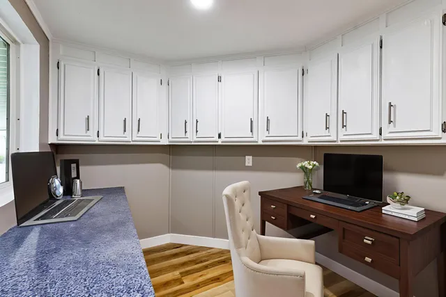 a view of cabinets and wooden floor