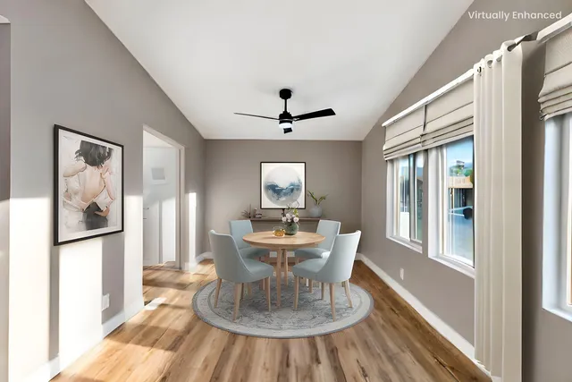 a view of a dining room with furniture window and wooden floor
