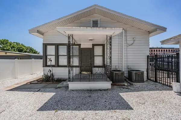 a front view of a house with a floor to ceiling window