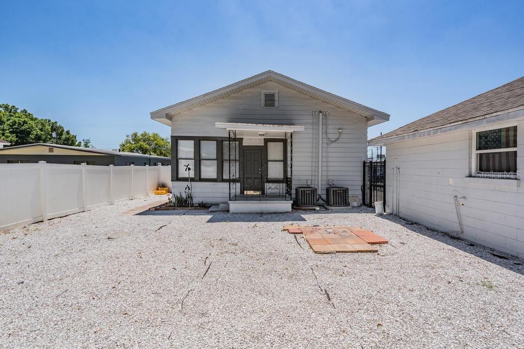 2319 West Aileen Street, Unit B Tampa, FL 33607 - Photo 2 of 19 a view of a house with wooden fence