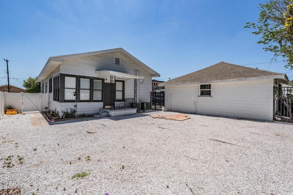 2319 West Aileen Street, Unit B Tampa, FL 33607 - Photo 4 of 19 a front view of a house with a yard