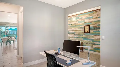 a workspace with furniture and a window