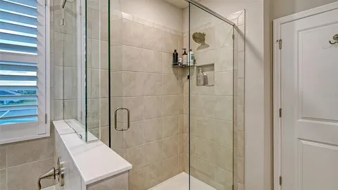 a bathroom with a shower and toilet