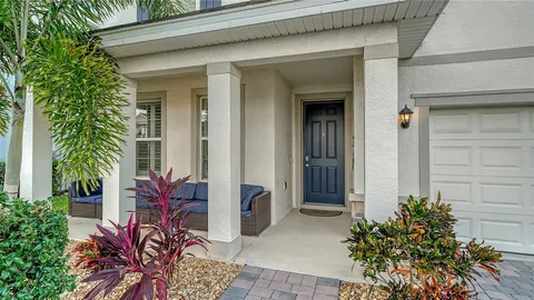 a potted plant sitting in front of a house