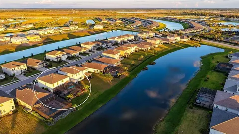 an aerial view of residential houses with outdoor space