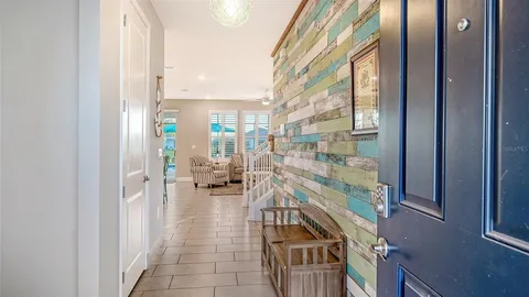 a view of open kitchen with wooden floor and furniture