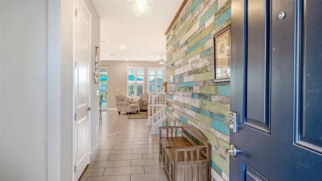 a view of open kitchen with wooden floor and furniture