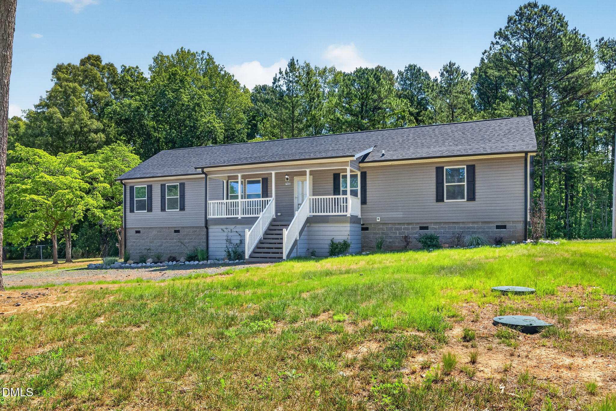 7122 Guess Road Hillsborough, NC 27278 - Photo 2 of 48 a house view with a garden space