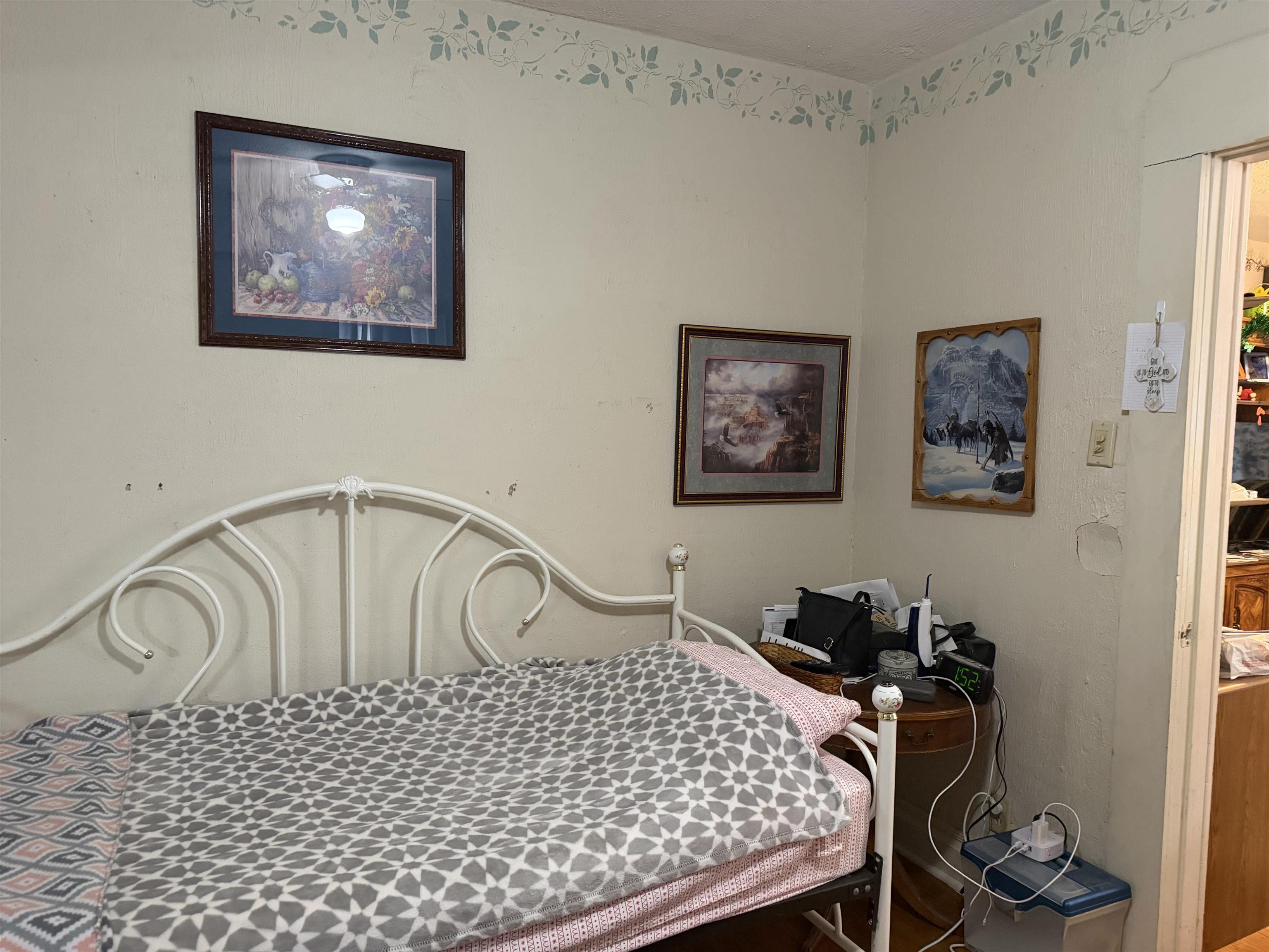 509 North Walnut Street Byron, IL 61010 - Photo 10 of 15 a bedroom with a bed and painting on the wall