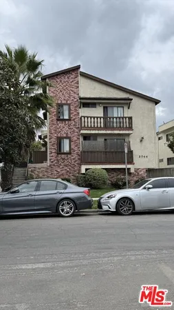 a front view of a house with parking space