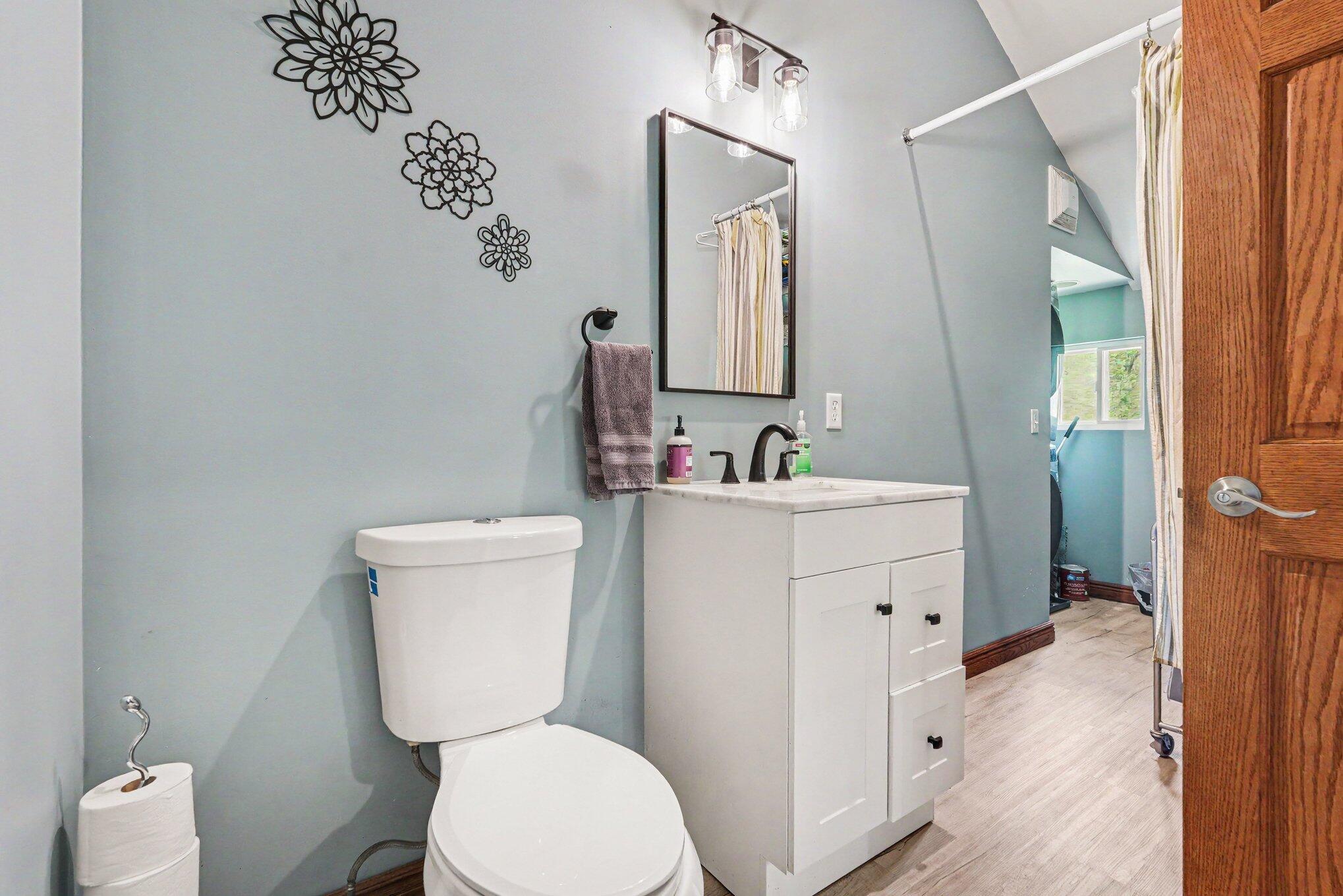 1721 Indian Lakes Road Northwest Kent City, MI 49330 - Photo 11 of 22 Bathroom and laundry Room