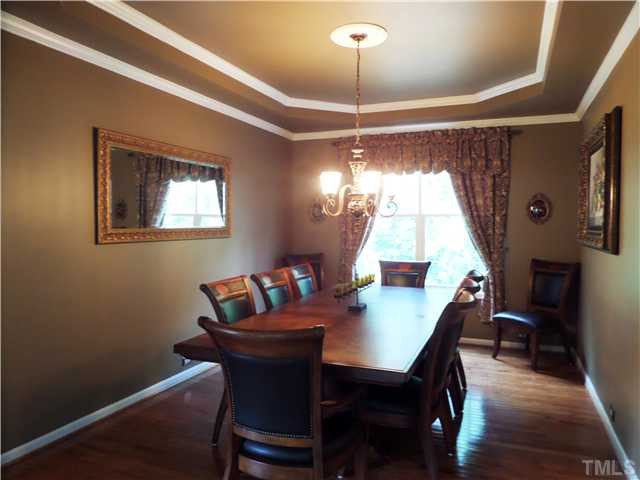 4441 Fairview Ridge Lane Apex, NC 27539 - Photo 4 of 25 Large Formal dining with trey ceiling and hardwoods, many upgrades and details added. Dining Room