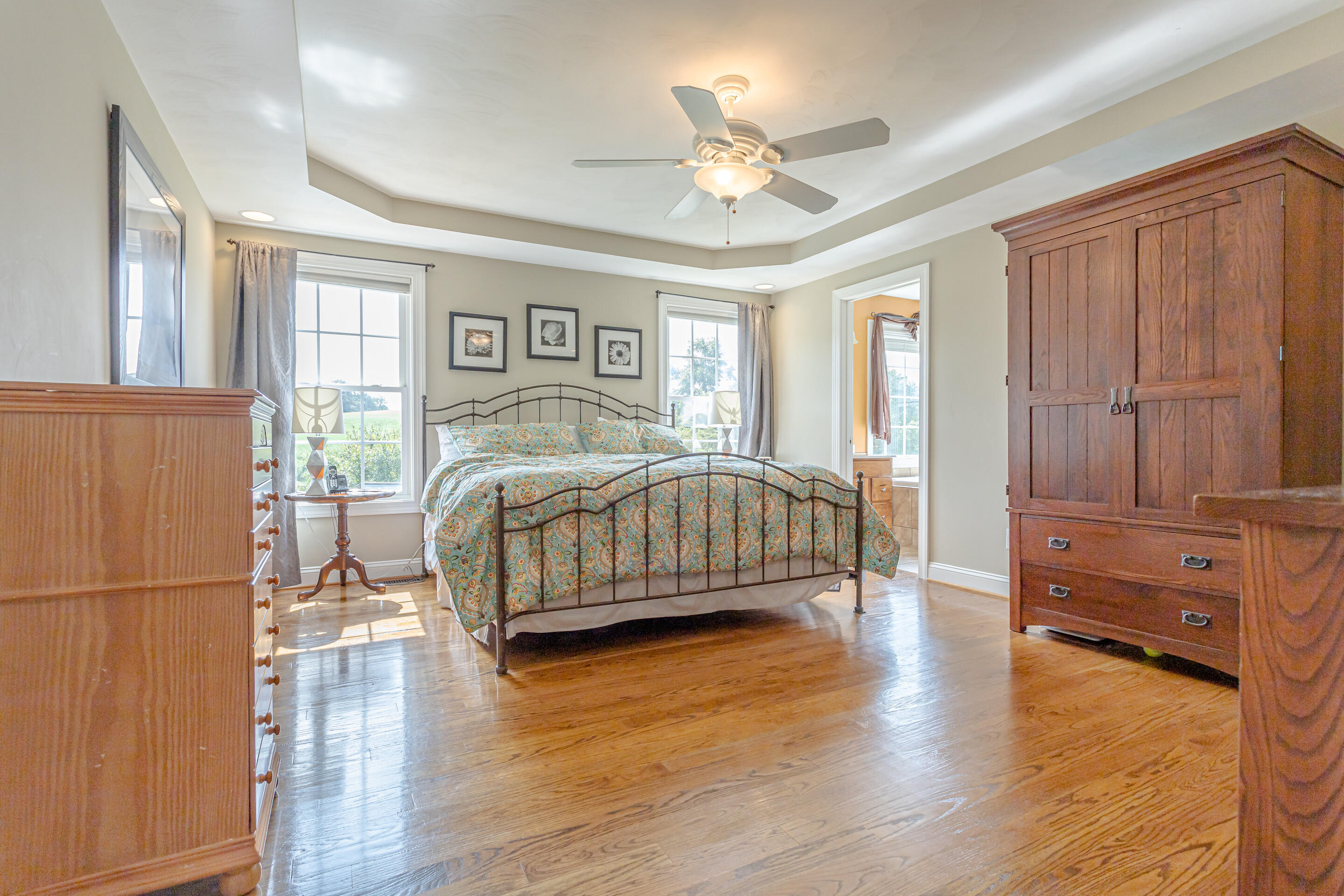 4510 Bethlehem Road Boones Mill, VA 24065 - Photo 14 of 48 a bedroom with a bed and wooden floor
