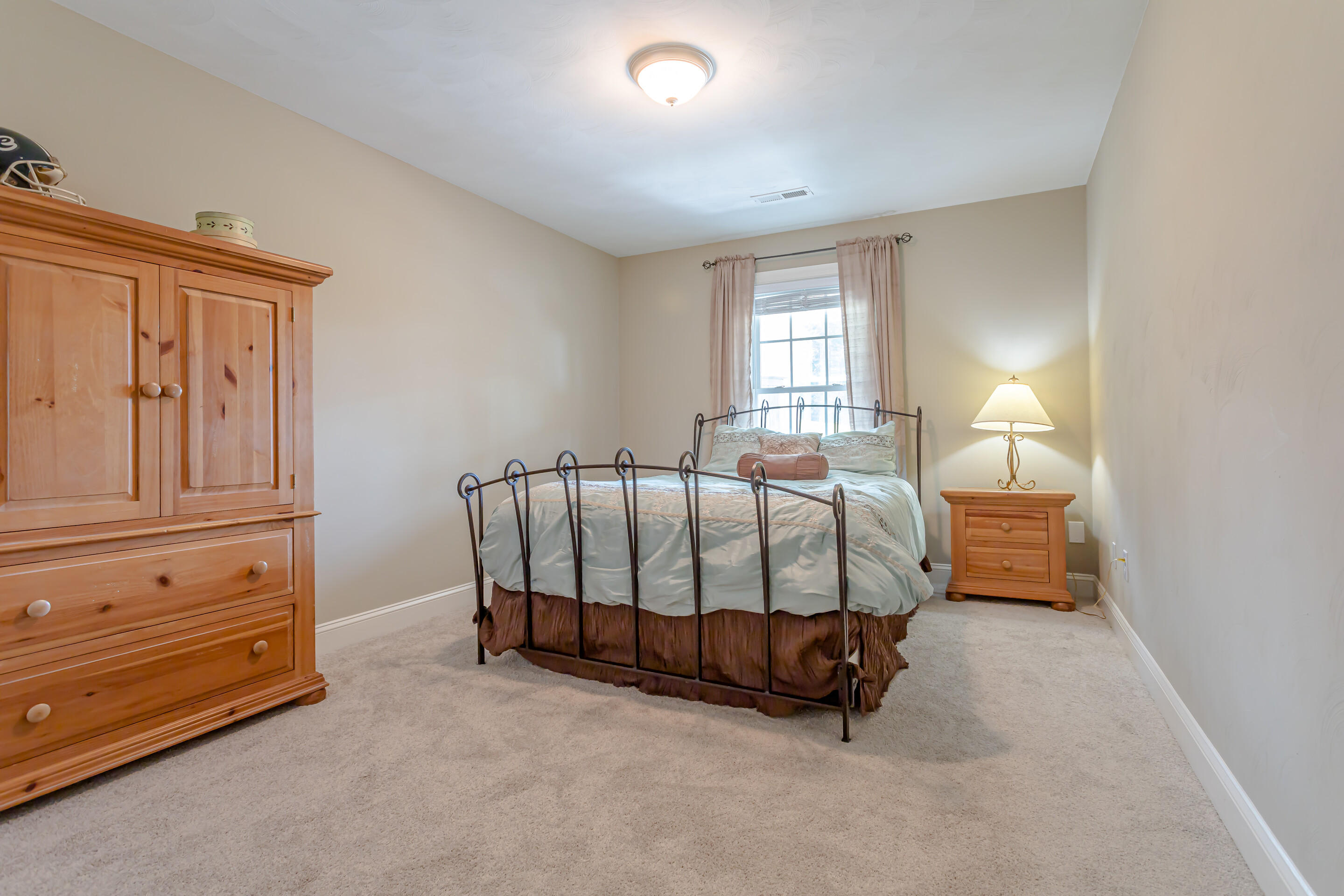 4510 Bethlehem Road Boones Mill, VA 24065 - Photo 26 of 48 a spacious bedroom with a bed and a window