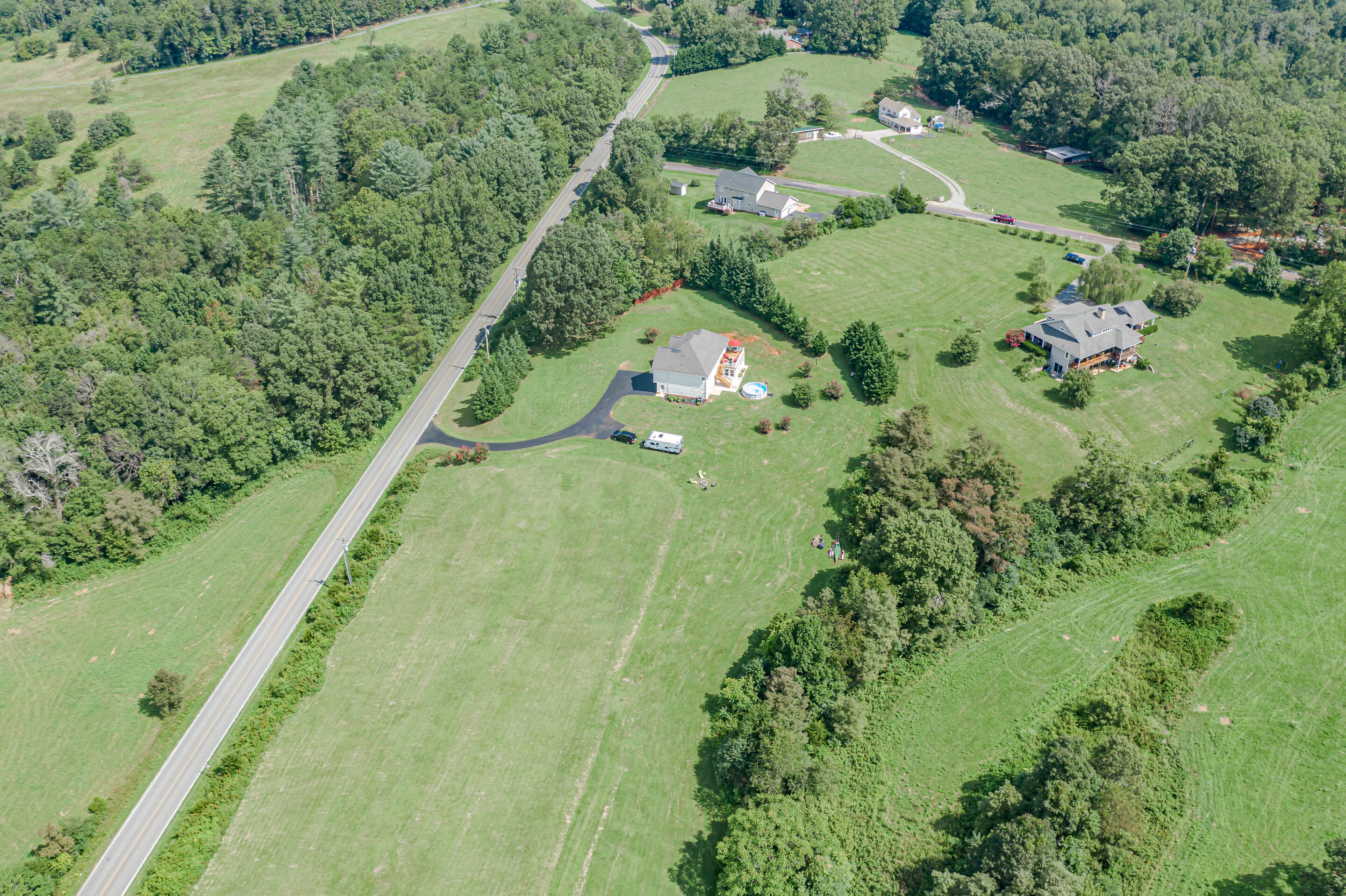 4510 Bethlehem Road Boones Mill, VA 24065 - Photo 40 of 48 a view of a garden with a lake
