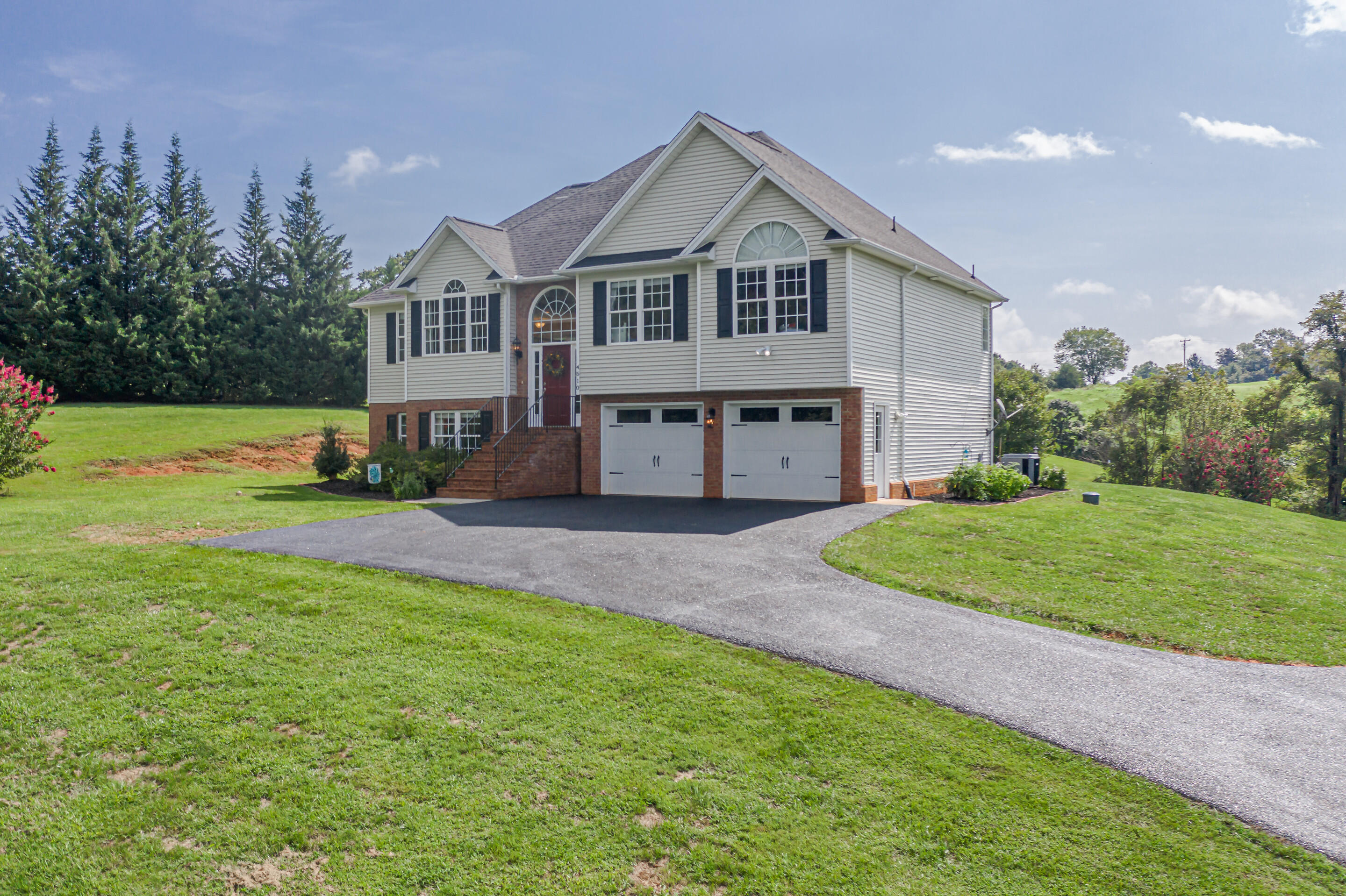 4510 Bethlehem Road Boones Mill, VA 24065 - Photo 45 of 48 a front view of a house with a yard and trees