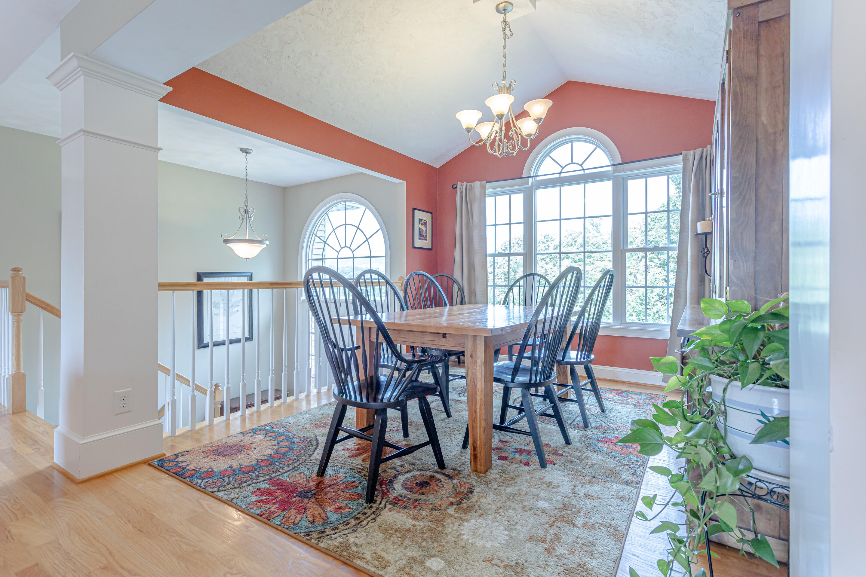 4510 Bethlehem Road Boones Mill, VA 24065 - Photo 7 of 48 a view of a dining room with furniture a chandelier and wooden floor