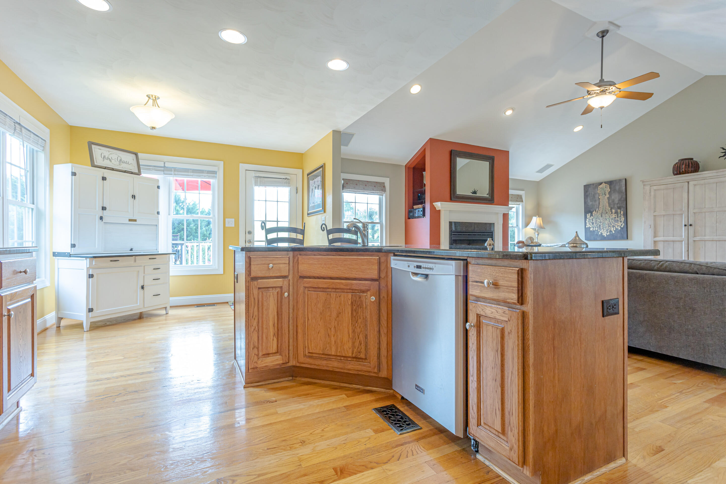 4510 Bethlehem Road Boones Mill, VA 24065 - Photo 10 of 48 a kitchen with kitchen island granite countertop a sink cabinets and wooden floor