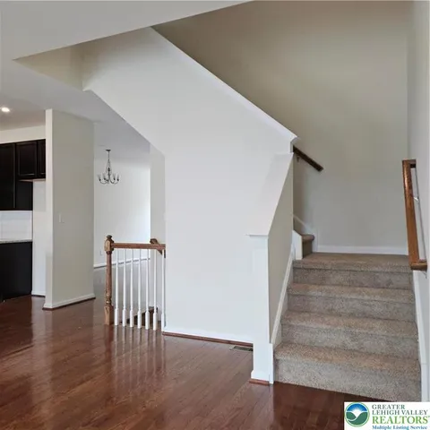 a view of entryway with wooden floor