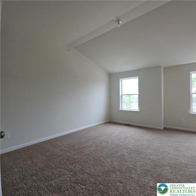 629 Fountain View Circle, Unit 8 Allentown, PA 18104 - Photo 9 of 16 an empty room with windows