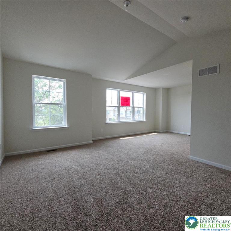 629 Fountain View Circle, Unit 8 Allentown, PA 18104 - Photo 10 of 16 an empty room with windows