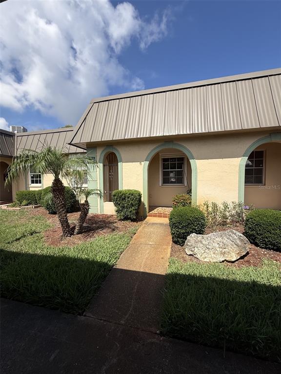 4413 Sunstate Drive New Port Richey, FL 34652 - Photo 1 of 14 a view of a house with backyard and sitting area