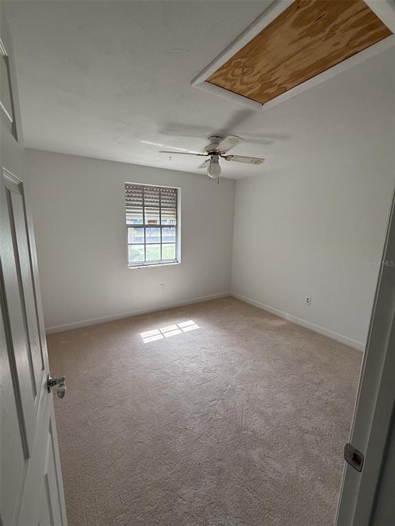 4413 Sunstate Drive New Port Richey, FL 34652 - Photo 13 of 14 an empty room with windows and closet