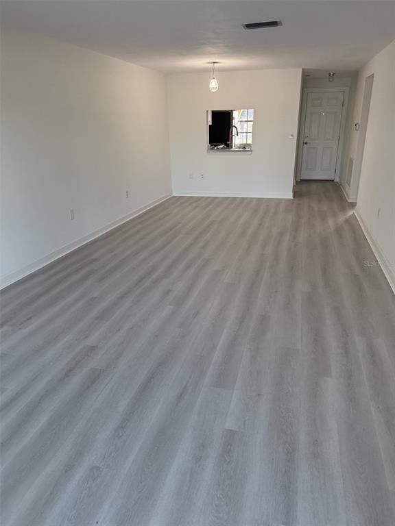 4413 Sunstate Drive New Port Richey, FL 34652 - Photo 2 of 14 a view of empty room with wooden floor