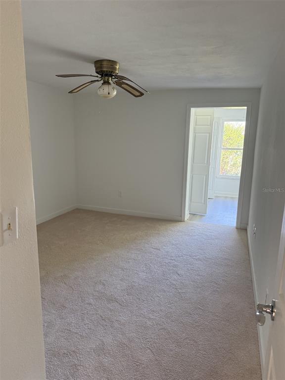 4413 Sunstate Drive New Port Richey, FL 34652 - Photo 10 of 14 an empty room with a window