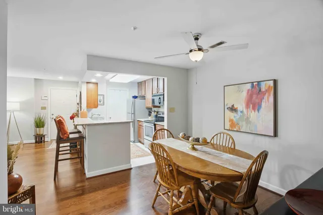 a view of a dining room with furniture and wooden floor