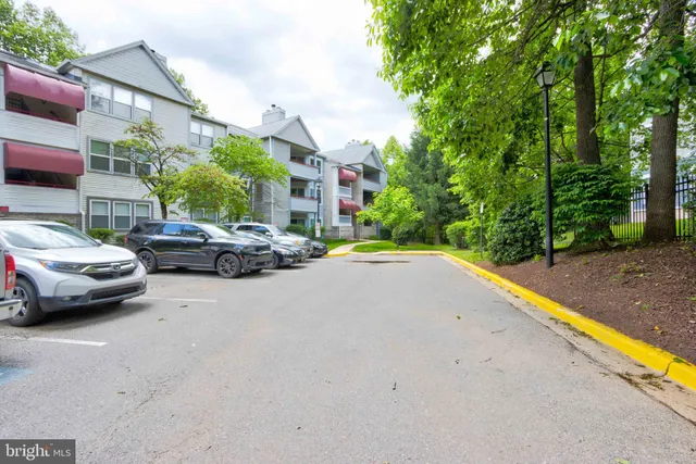 a view of street with parked cars