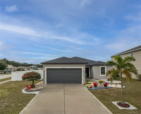 a front view of a house with garage