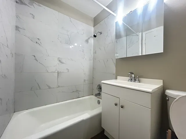 a bathroom with a sink toilet and bathtub