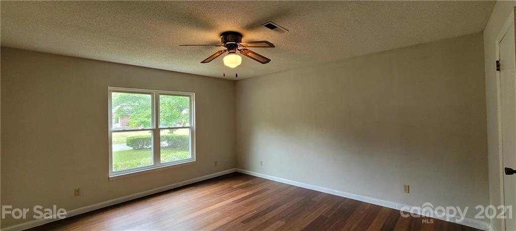 707 Finley Road Rock Hill, SC 29730 - Photo 14 of 26 an empty room with a window and a fan