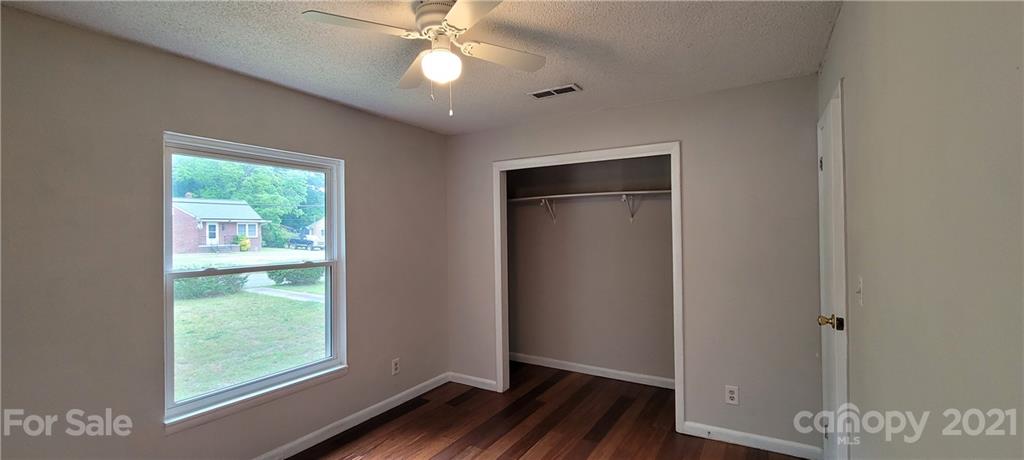 707 Finley Road Rock Hill, SC 29730 - Photo 17 of 26 a view of an empty room with wooden floor and a window