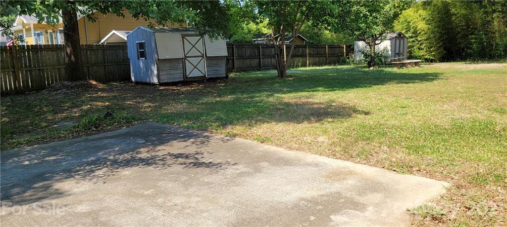 707 Finley Road Rock Hill, SC 29730 - Photo 21 of 26 a view of a backyard with wooden fence