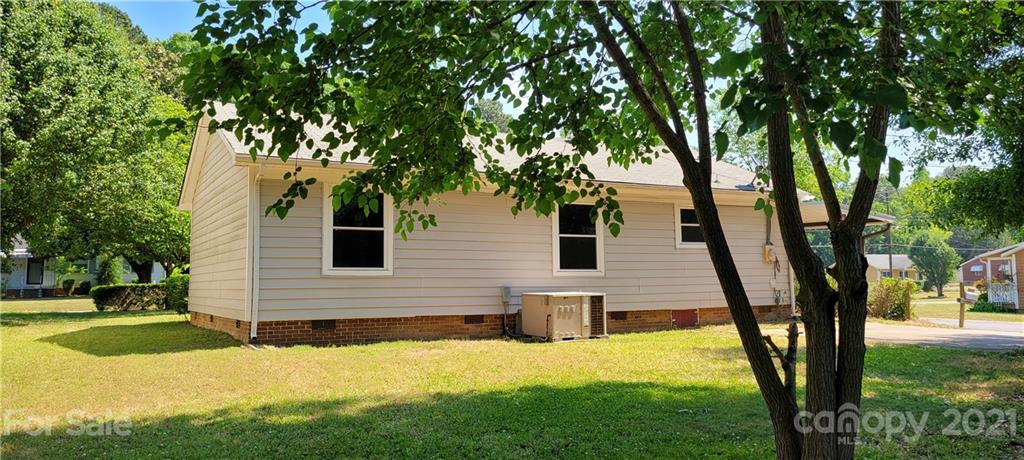 707 Finley Road Rock Hill, SC 29730 - Photo 22 of 26 a yellow house in middle of a yard