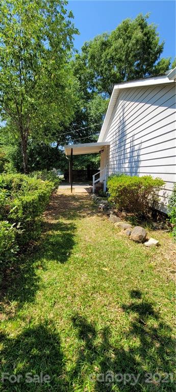 707 Finley Road Rock Hill, SC 29730 - Photo 24 of 26 a backyard of a house with plants and large trees