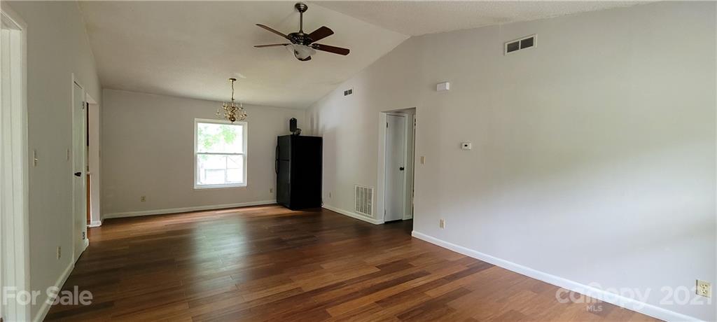 707 Finley Road Rock Hill, SC 29730 - Photo 5 of 26 wooden floor in an empty room with a window