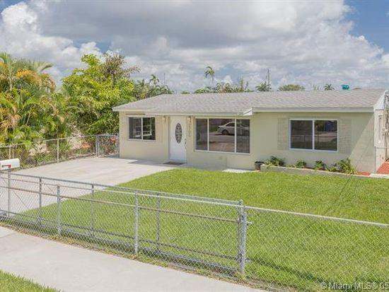Undisclosed Address Hollywood, FL 33020 - Photo 1 of 8 a view of a house with a backyard and a garden