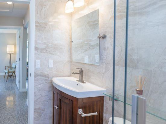 Undisclosed Address Hollywood, FL 33020 - Photo 5 of 8 a bathroom with a sink and a mirror