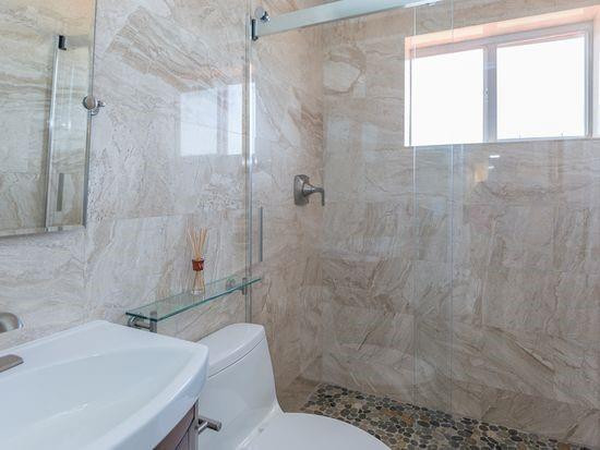 Undisclosed Address Hollywood, FL 33020 - Photo 6 of 8 a bathroom with a sink toilet and shower