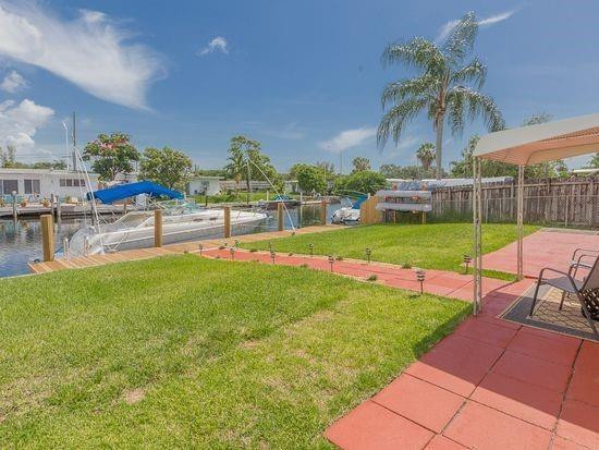 Undisclosed Address Hollywood, FL 33020 - Photo 7 of 8 a view of a backyard and swimming pool