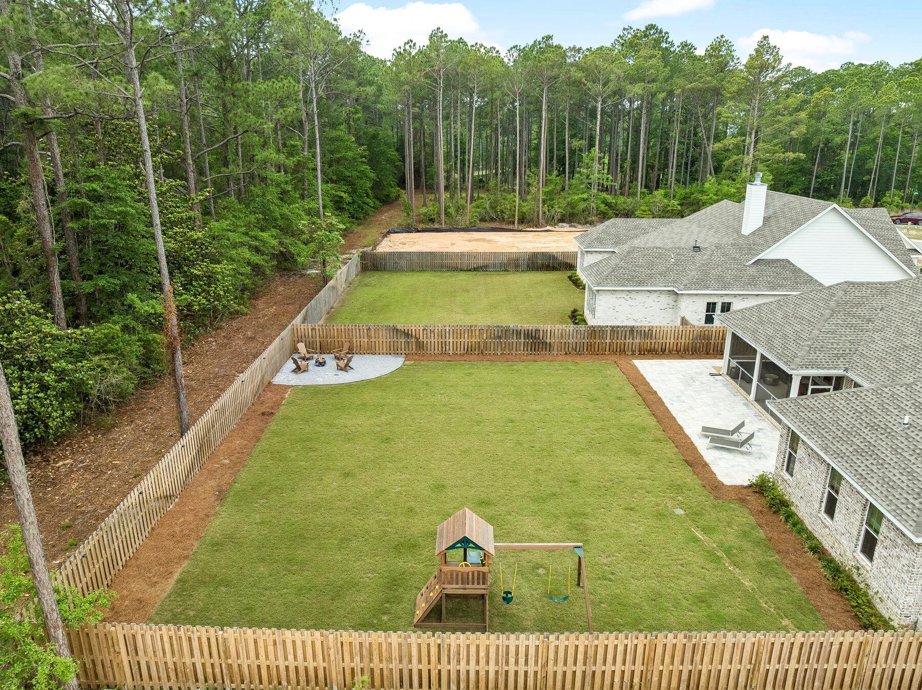 39 West Captain Fritz Way Freeport, FL 32439 - Photo 4 of 33 a view of a swimming pool with a yard and mountain view