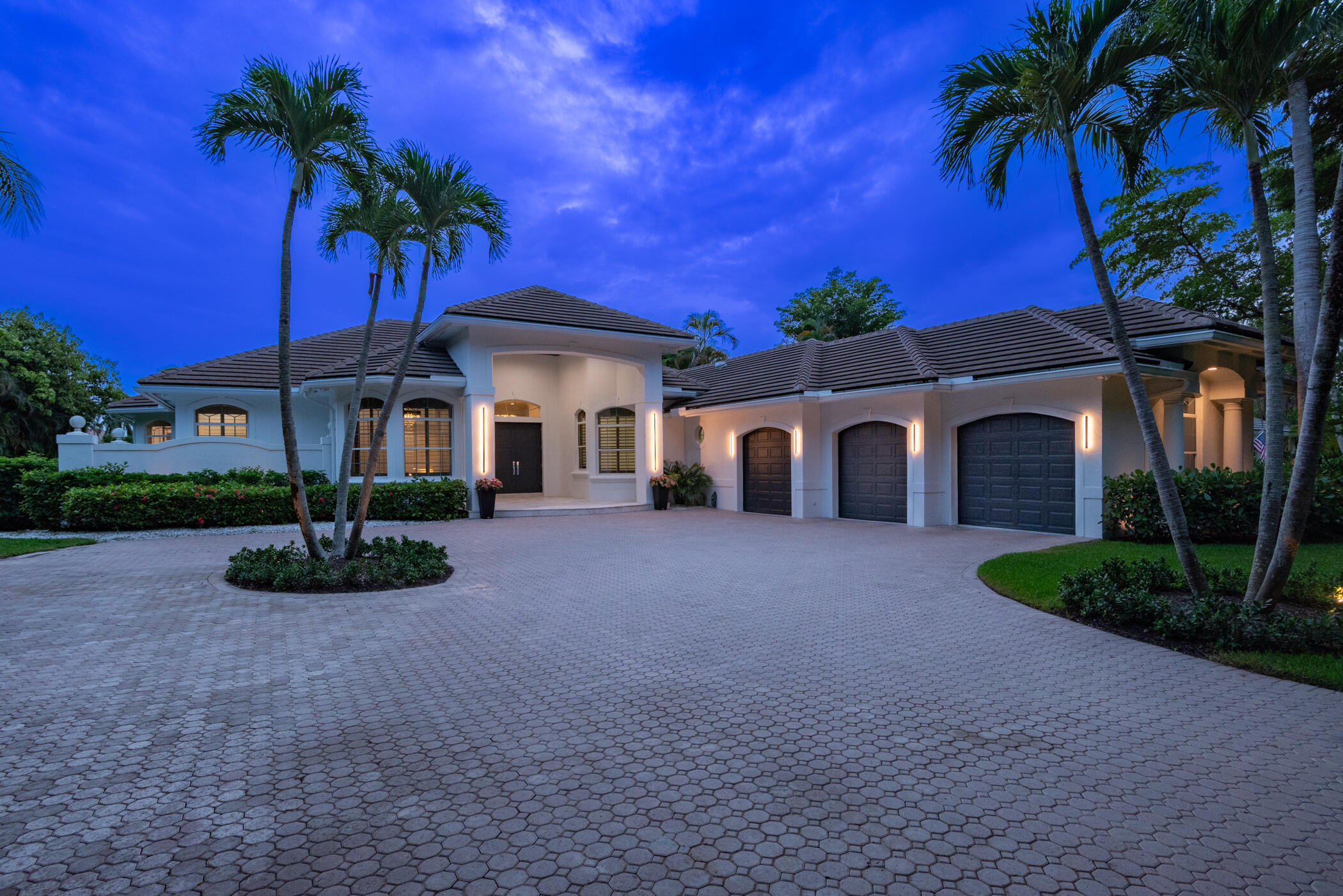 8246 Man O War Road Palm Beach Gardens, FL 33418 - Photo 12 of 55 Front Exterior at Twilight
