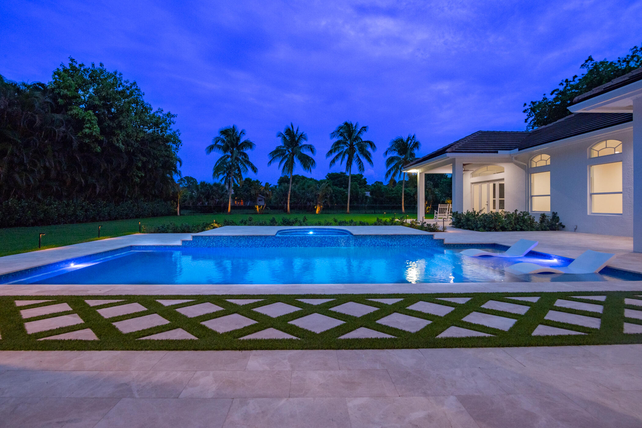 8246 Man O War Road Palm Beach Gardens, FL 33418 - Photo 14 of 55 Pool at Twilight