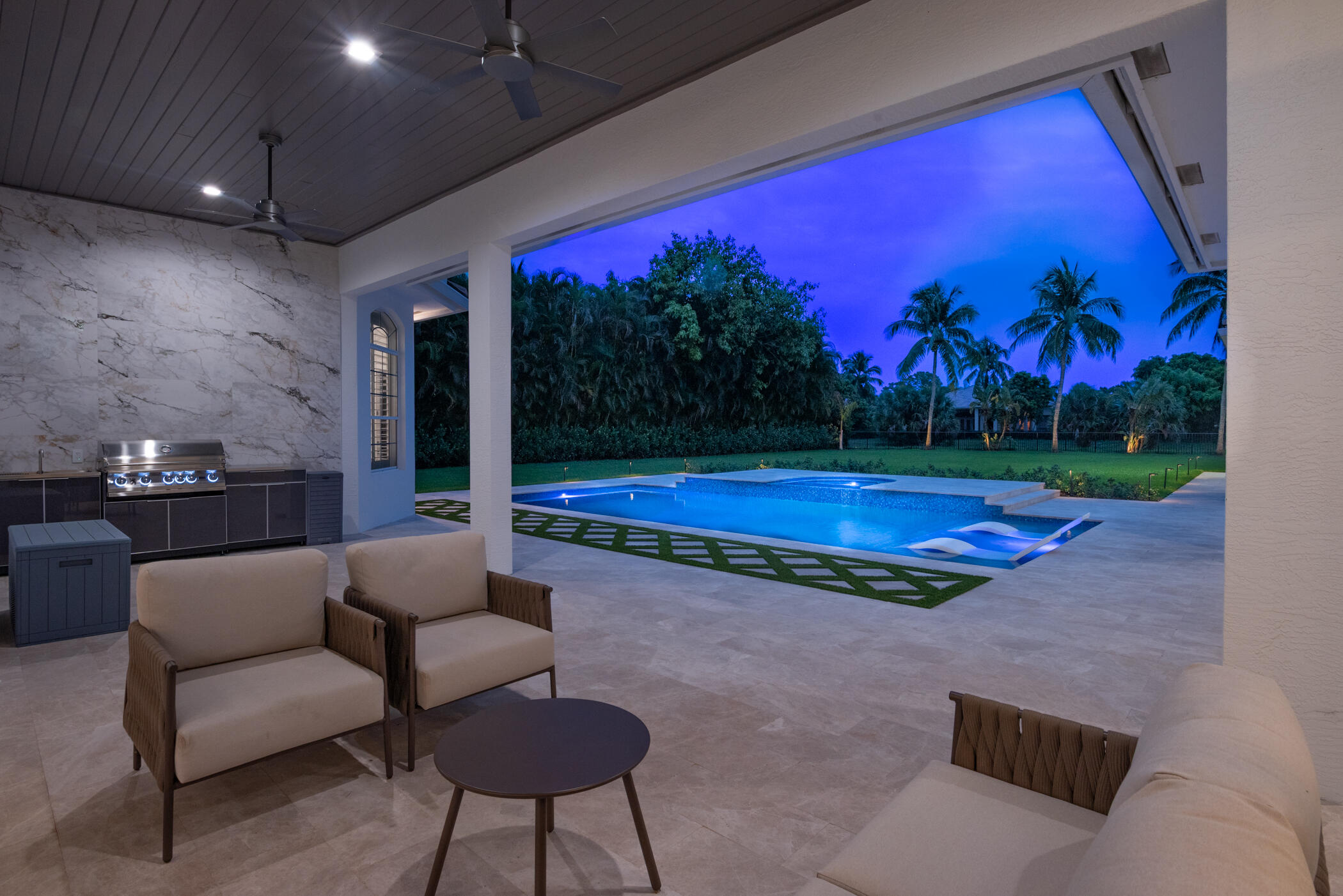 8246 Man O War Road Palm Beach Gardens, FL 33418 - Photo 15 of 55 Patio and Pool at Twilight
