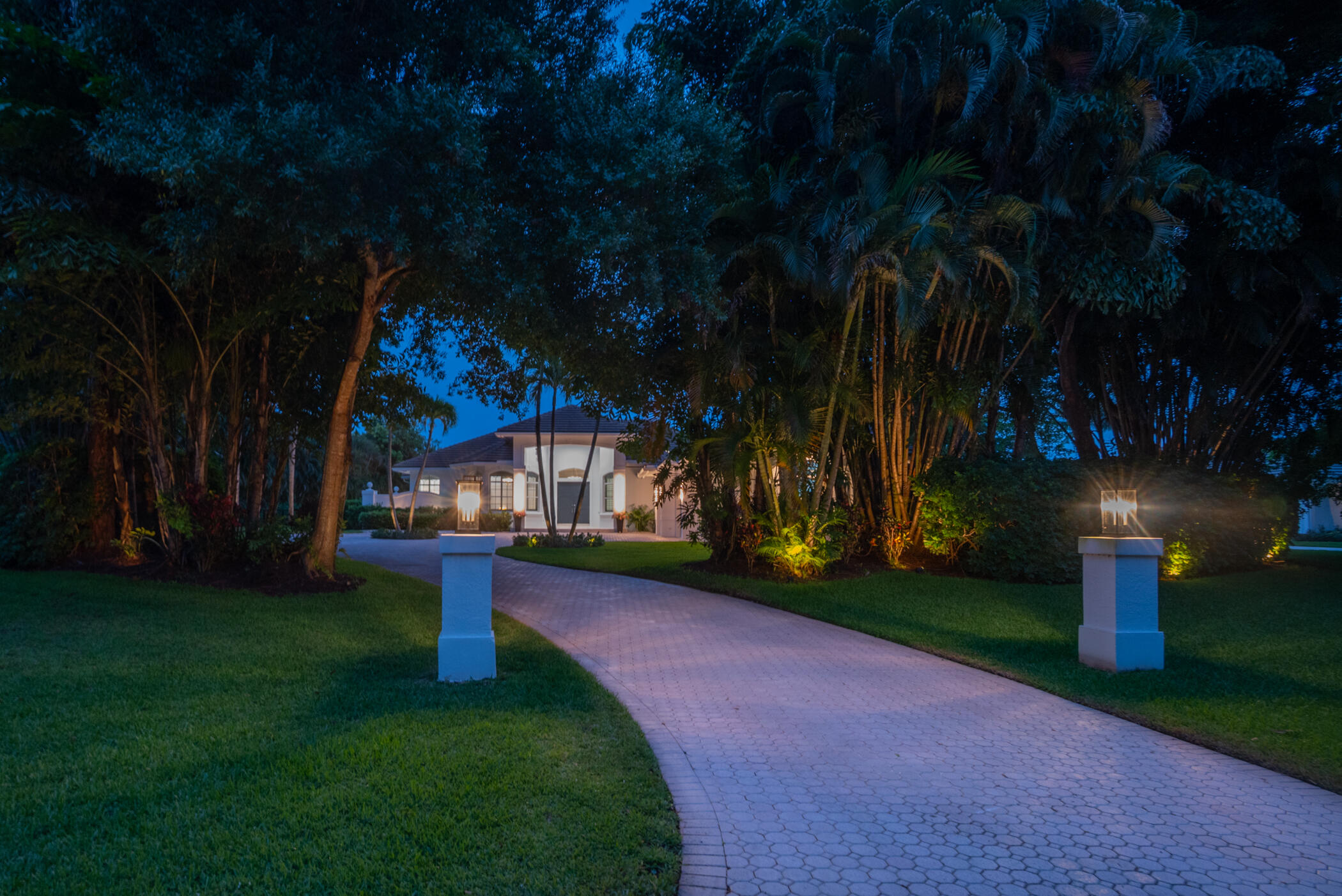8246 Man O War Road Palm Beach Gardens, FL 33418 - Photo 55 of 55 Driveway at Twilight